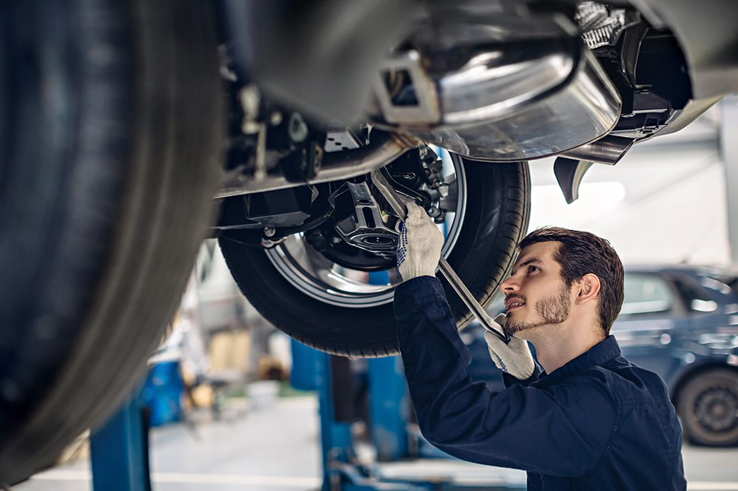 Man checking vehicle